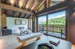 Experience the epitome of luxury living in this stunning property, boasting a beautifully designed interior with exposed wooden beams and a cozy ambiance.