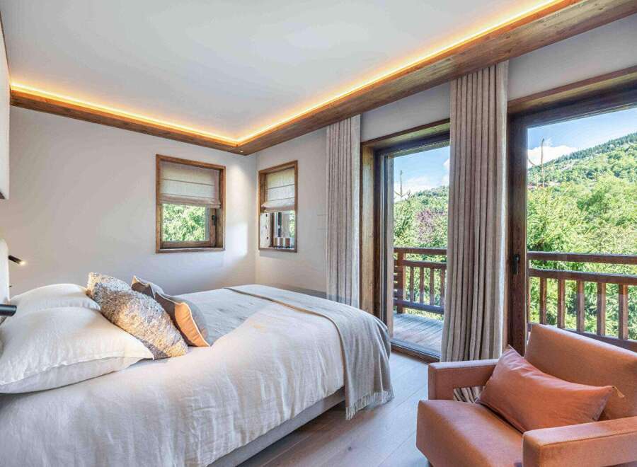 Experience the epitome of luxury in this stunning bedroom, featuring a serene ambiance and breathtaking views.
