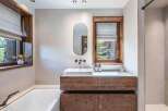 This stunning bathroom boasts a modern design with rustic elements.