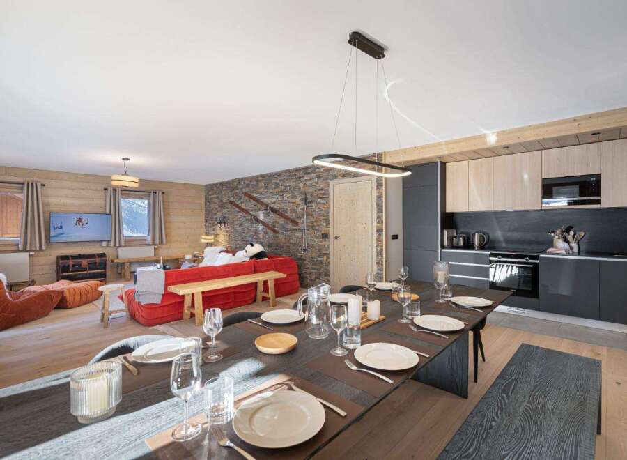 Experience luxury living in this stunning property, featuring a spacious dining area perfect for entertaining.