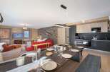 Experience luxury living in this stunning property, featuring a spacious dining area perfect for entertaining.