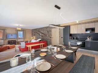 Experience luxury living in this stunning property, featuring a spacious dining area perfect for entertaining.