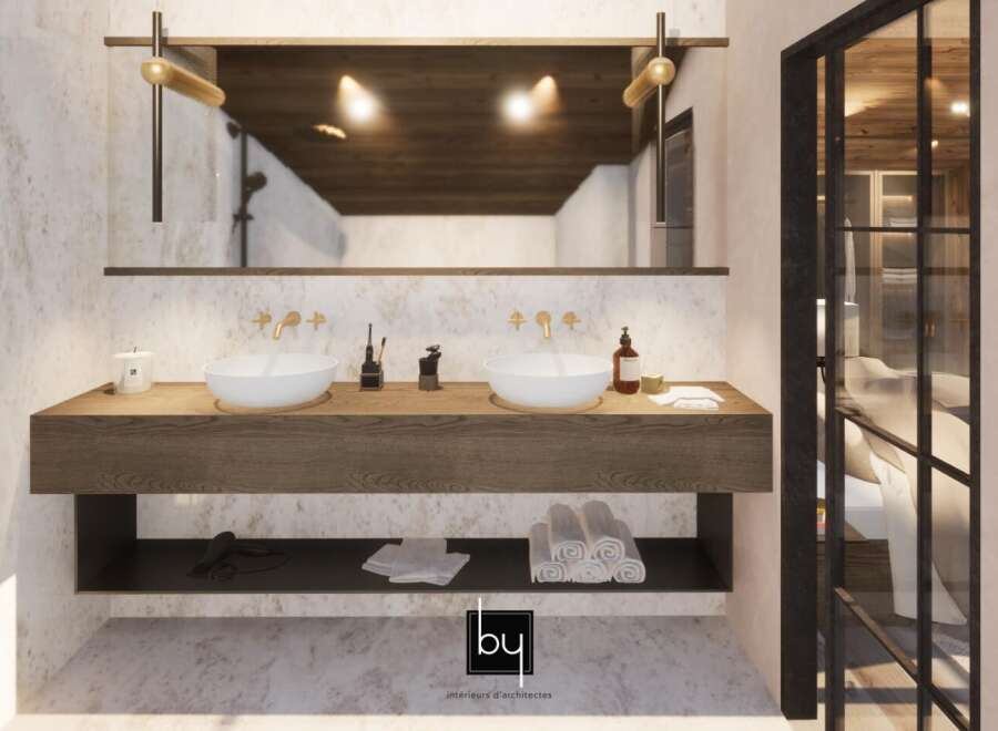 This stunning bathroom features a modern design with a wooden vanity and sleek white sinks.