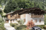 Discover the charm of this stunning mountain chalet, perfectly nestled amidst a lush, green landscape.