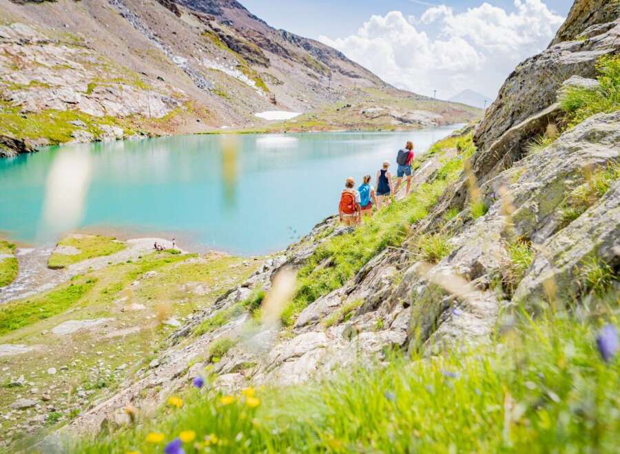 Explore the breathtaking beauty of this stunning mountain property, offering unparalleled views of a pristine turquoise lake.