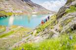 Explore the breathtaking beauty of this stunning mountain property, offering unparalleled views of a pristine turquoise lake.