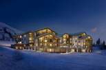 Experience luxury living in this stunning mountain lodge, perfect for a winter getaway.