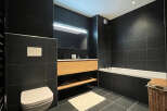Step into modern luxury with this stunning bathroom design.