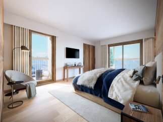 Experience luxury living in this stunning bedroom with breathtaking mountain views.