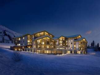 Experience luxury living in this stunning mountain lodge, perfect for a winter getaway.