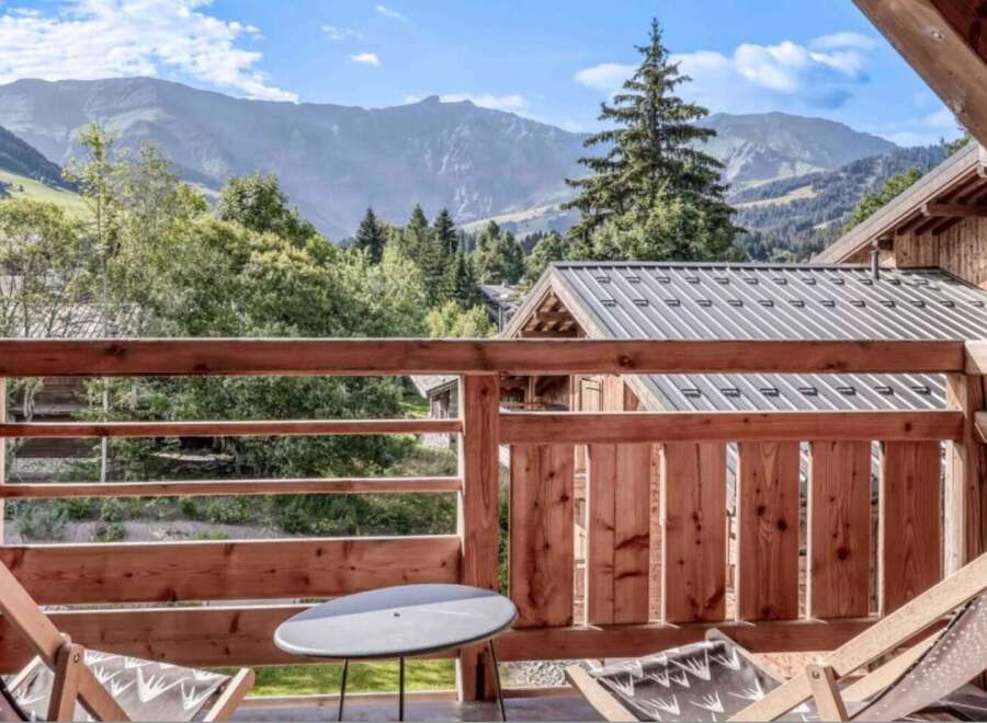Enjoy breathtaking mountain views from this charming balcony.