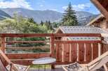 Enjoy breathtaking mountain views from this charming balcony.