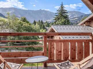 Enjoy breathtaking mountain views from this charming balcony.