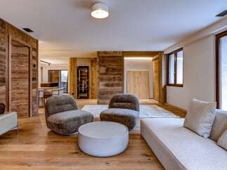 Experience luxury living in this stunning property, featuring exquisite wooden accents and a modern design.