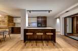 This stunning kitchen boasts a modern design with a warm, inviting feel.