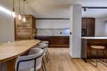 This stunning kitchen and dining area boasts a modern design with a touch of rustic charm.