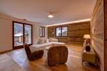 This stunning living room boasts a warm and inviting atmosphere, perfect for relaxation and entertaining.