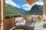Experience breathtaking mountain views from this stunning balcony.