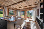 This stunning property boasts a warm and inviting interior with a focus on natural materials.