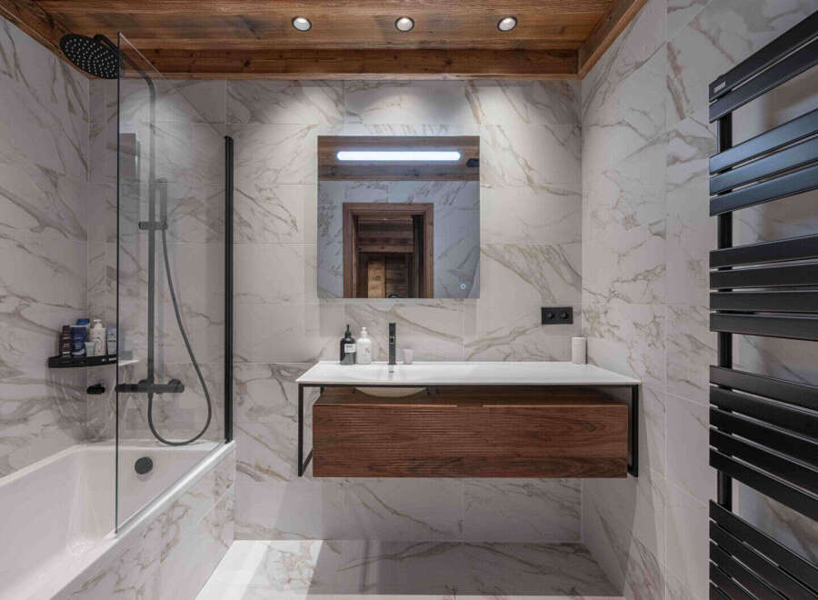 Step into luxury with this stunning bathroom featuring a sleek, modern design.