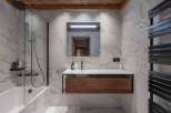 Step into luxury with this stunning bathroom featuring a sleek, modern design.