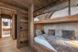 This stunning property boasts a rustic charm with its exquisite wooden interior, creating a warm and inviting atmosphere.