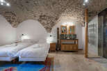 Experience rustic elegance in this unique property featuring a stunning stone-vaulted ceiling.