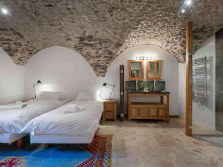 Experience rustic elegance in this unique property featuring a stunning stone-vaulted ceiling.