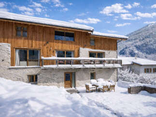 This stunning chalet offers a perfect blend of rustic charm and modern comfort, nestled in a picturesque winter wonderland.