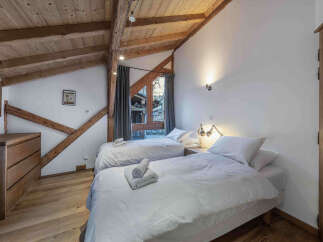Discover the charm of this cozy bedroom, perfect for a relaxing getaway.