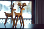 Enhance your home decor with these charming wooden reindeer figurines.