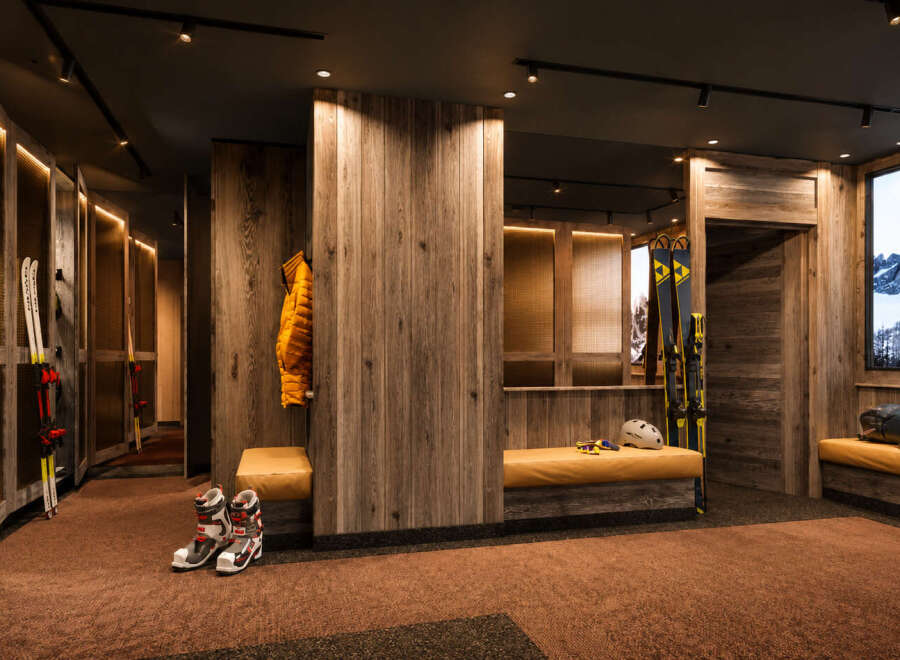 Experience the ultimate ski lodge ambiance with this beautifully designed ski room.