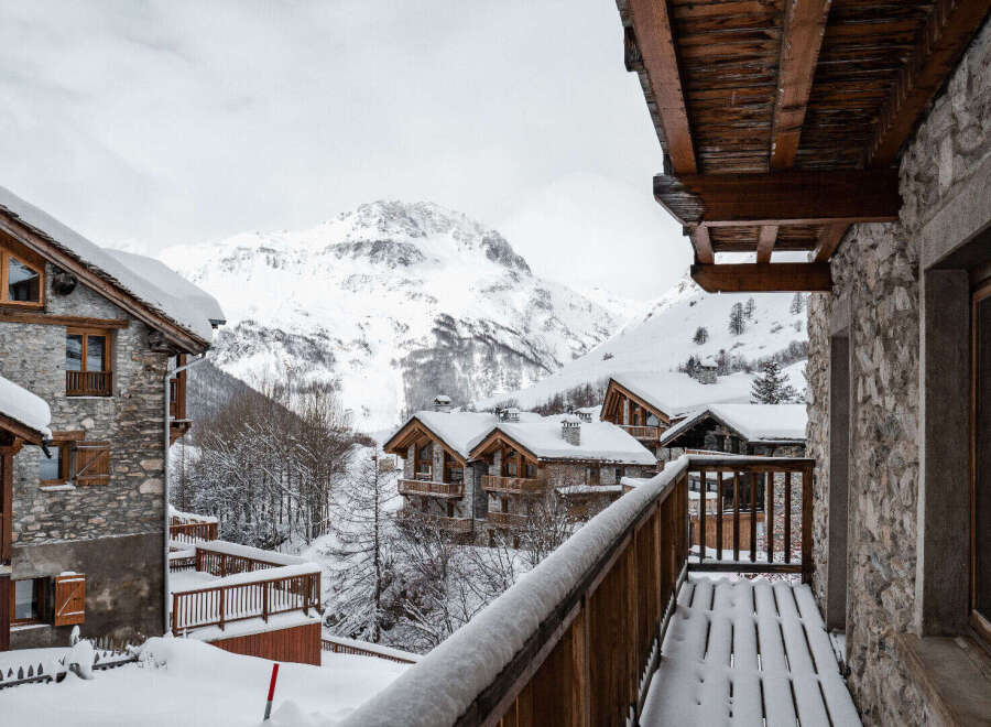 Experience the charm of a snow-covered mountain chalet, perfect for a winter getaway.