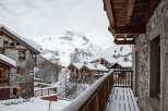 Experience the charm of a snow-covered mountain chalet, perfect for a winter getaway.