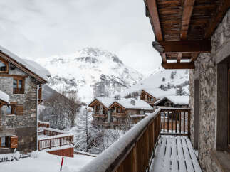 Experience the charm of a snow-covered mountain chalet, perfect for a winter getaway.