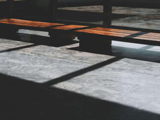 This image showcases a modern interior space, highlighting the interplay of light and shadow.