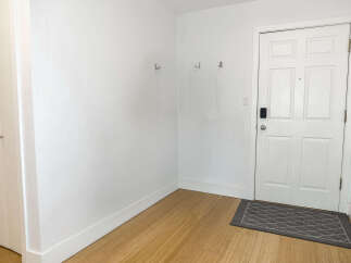 Step into a bright and inviting entryway, perfect for welcoming guests.