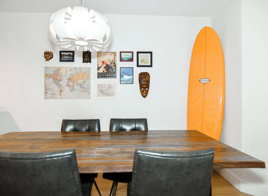 This stunning property boasts a modern dining area, perfect for entertaining guests.