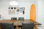 This stunning property boasts a modern dining area, perfect for entertaining guests.
