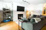 This stunning living room boasts a modern fireplace, perfect for cozy evenings.