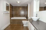 Step into this modern bathroom, featuring a sleek design and high-end finishes.