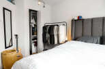 This stylish bedroom offers a serene retreat with its modern design and ample space.