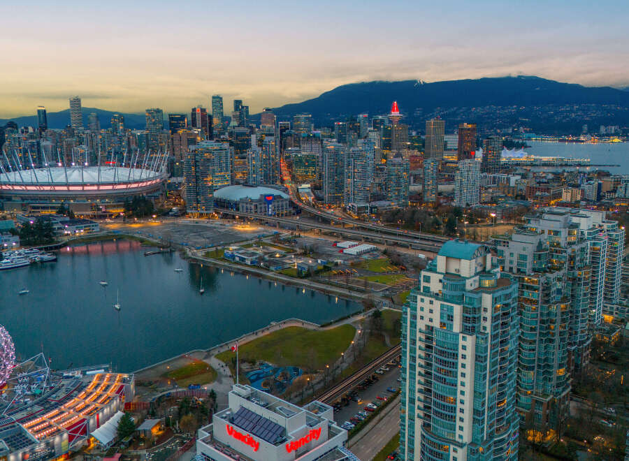 Experience the vibrant city life with this stunning aerial view of Vancouver's skyline.