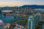 Experience the vibrant city life with this stunning aerial view of Vancouver's skyline.