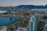 Experience the vibrant city life with this stunning aerial view of Vancouver's skyline.
