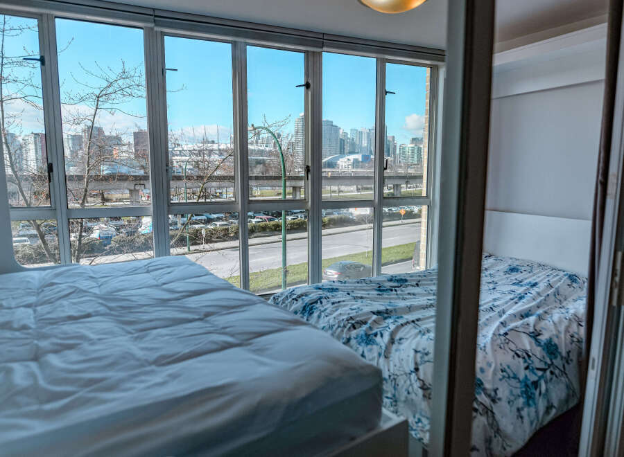 Enjoy stunning city views from this modern condo featuring two comfortable beds.