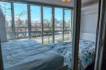 Enjoy stunning city views from this modern condo featuring two comfortable beds.