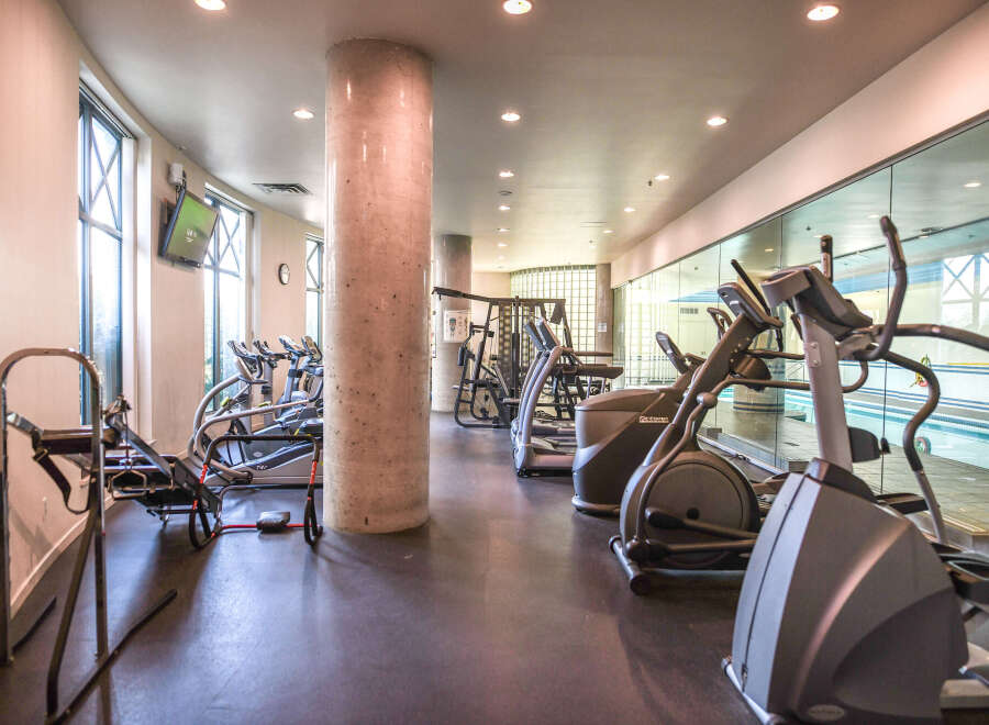 This modern fitness center offers a variety of exercise equipment, perfect for a comprehensive workout.
