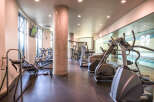 This modern fitness center offers a variety of exercise equipment, perfect for a comprehensive workout.