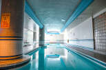 This stunning indoor pool offers a serene and inviting atmosphere, perfect for relaxation and exercise.